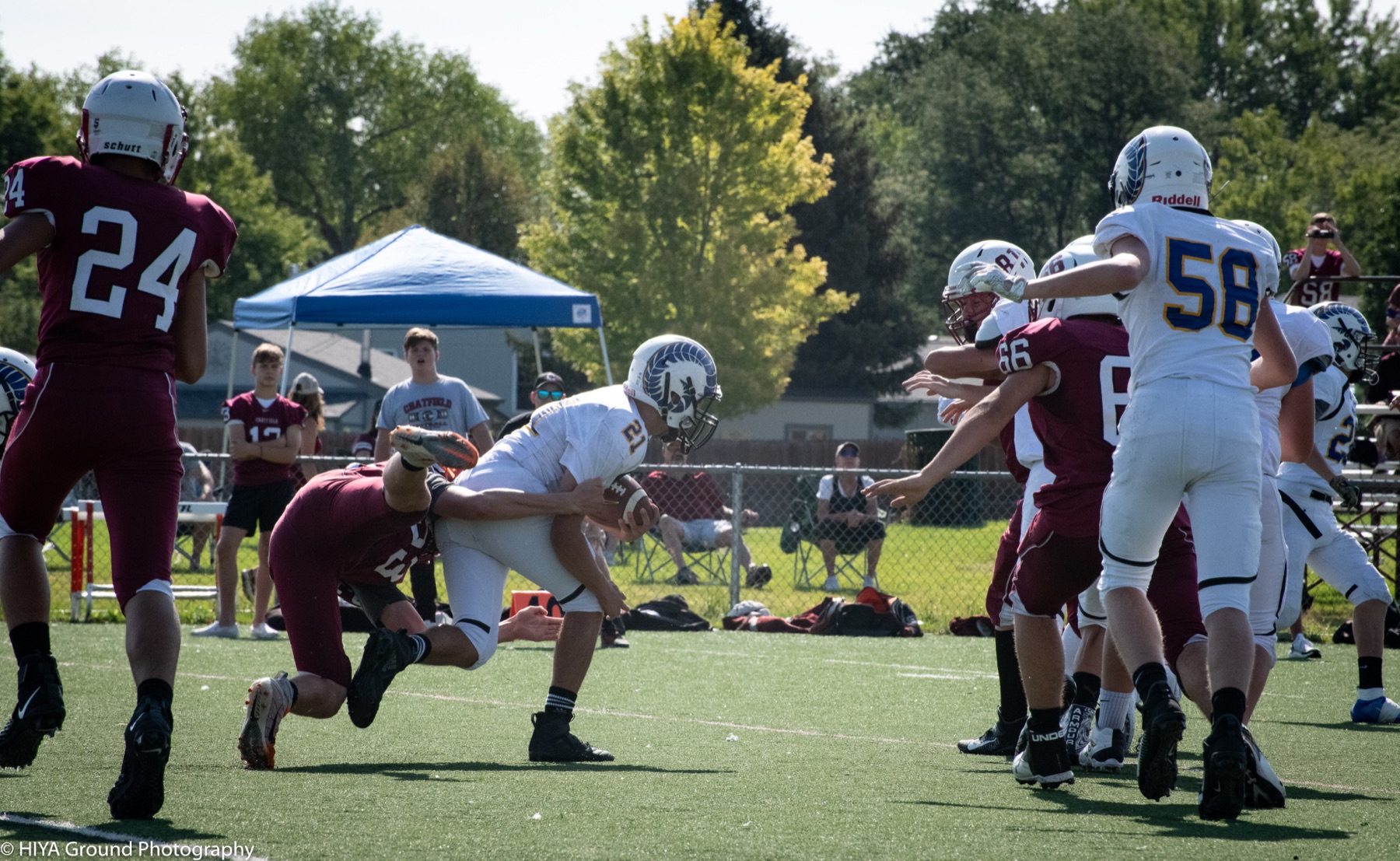 Football player breaking a tackle