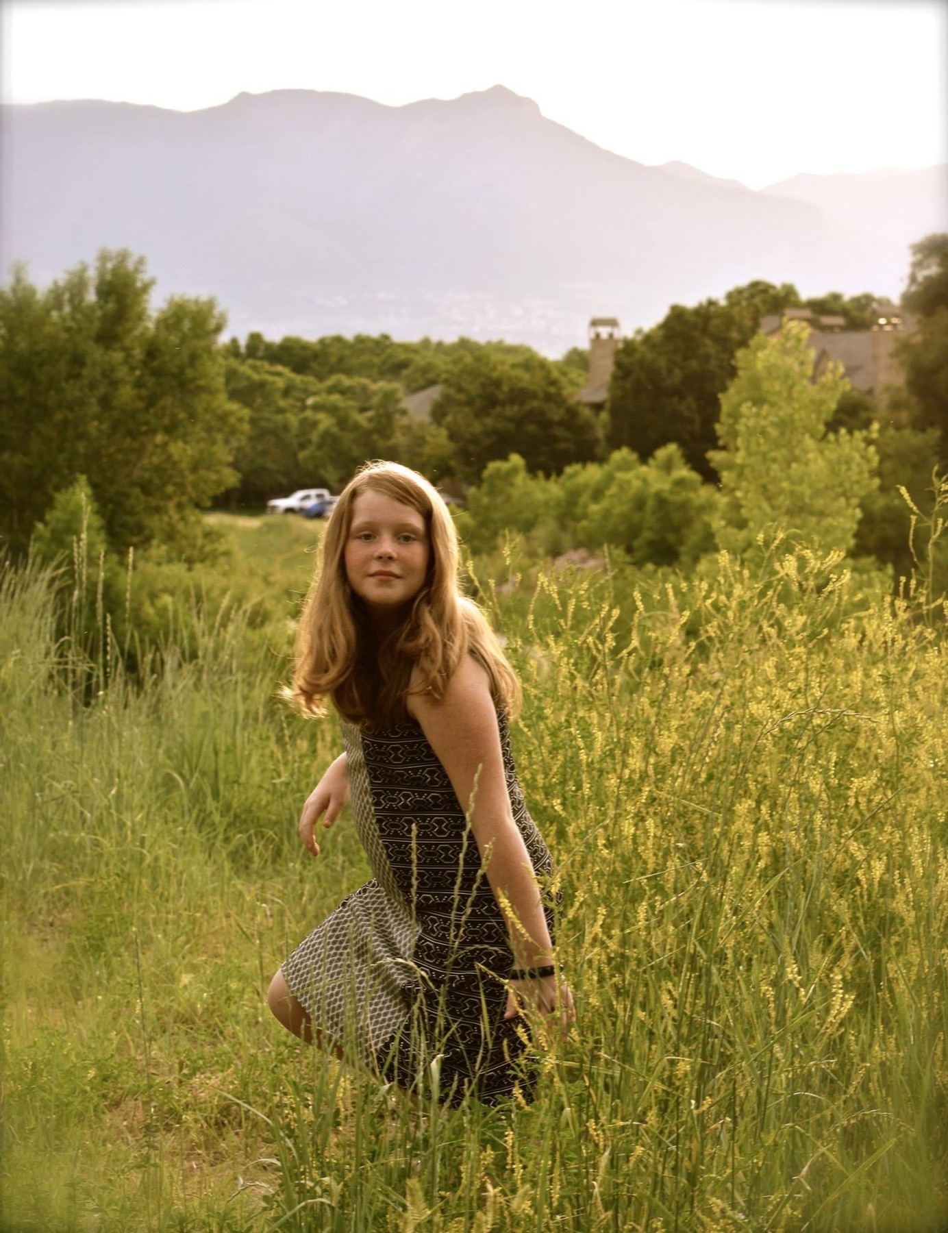 Senior portrait in a mountain field